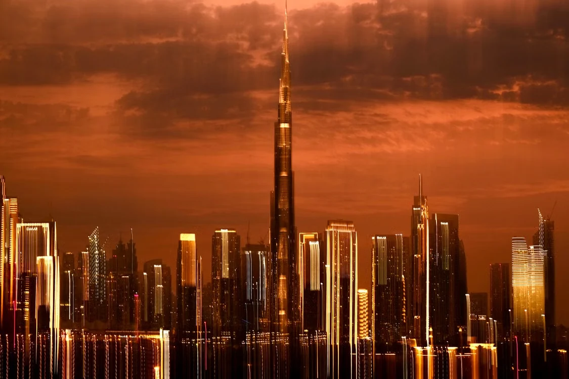 Burj Khalifa rising above the Dubai skyline at sunset; illustrative destination photograph by Chinar Minar on Pexels
